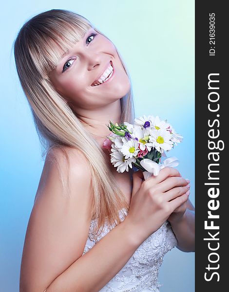 Portrait of happy bride with a bouquet. Portrait of happy bride with a bouquet