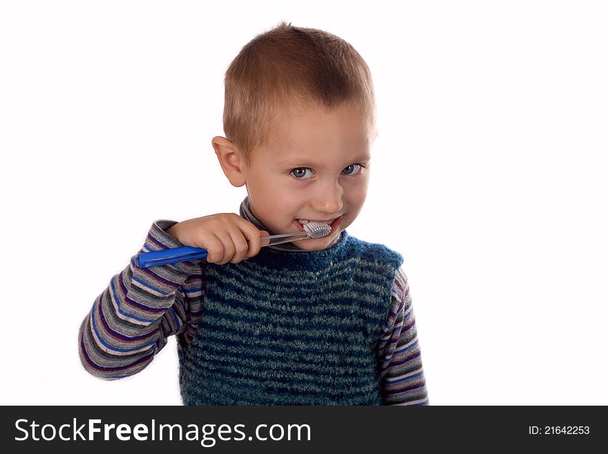 Boy brushing his teeth isolated on white background. Boy brushing his teeth isolated on white background..