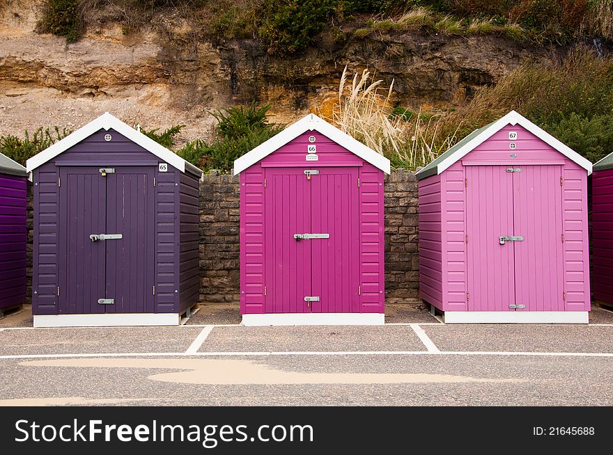 Colorful, colourful beach huts at an English beach resort. Colorful, colourful beach huts at an English beach resort.
