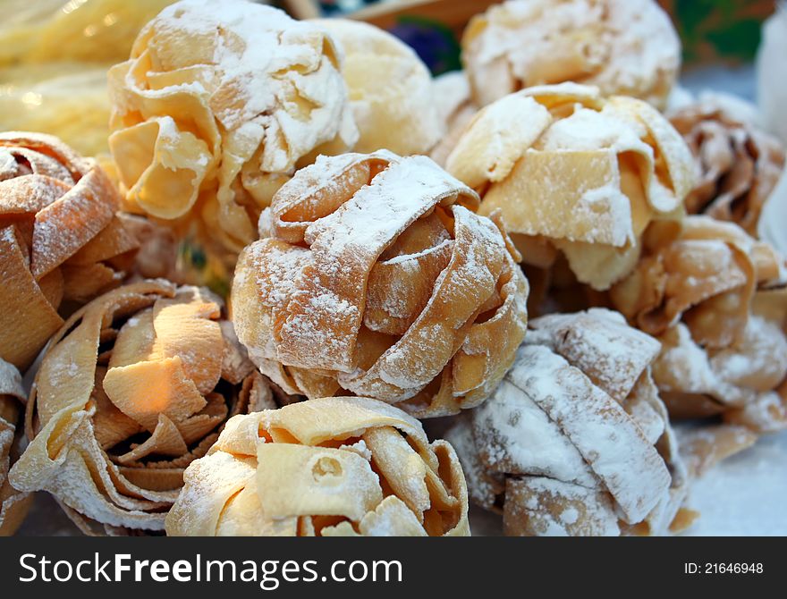 Ball shaped cookies made from domestic pasta with powder sugar. Ball shaped cookies made from domestic pasta with powder sugar