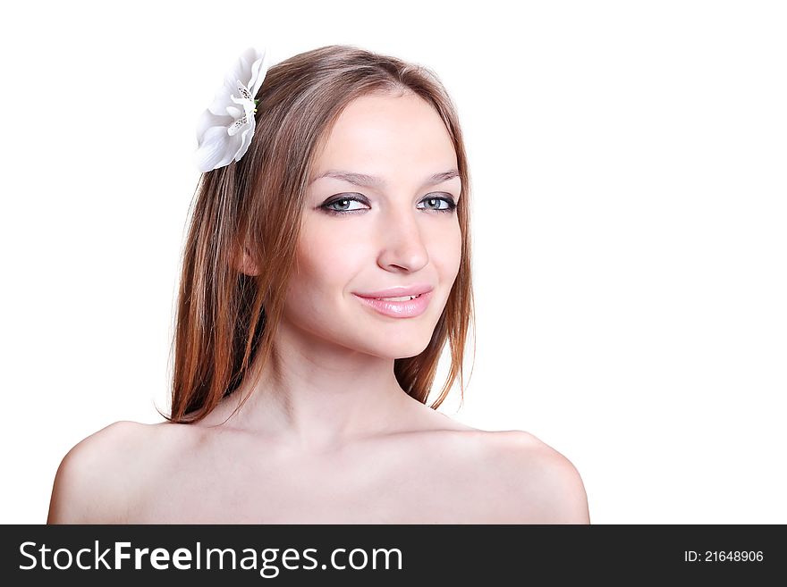 Face of beautiful young woman with flower in her hair isolated on white. Face of beautiful young woman with flower in her hair isolated on white