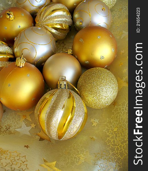 Golden christmas balls on a christmas background