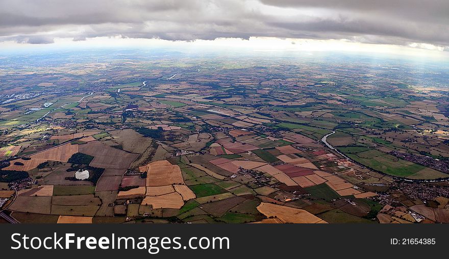 Aerial shot from just below the clouds of south Worcestershire with river Severn, River Avon and M50 motorway in view looking south England UK