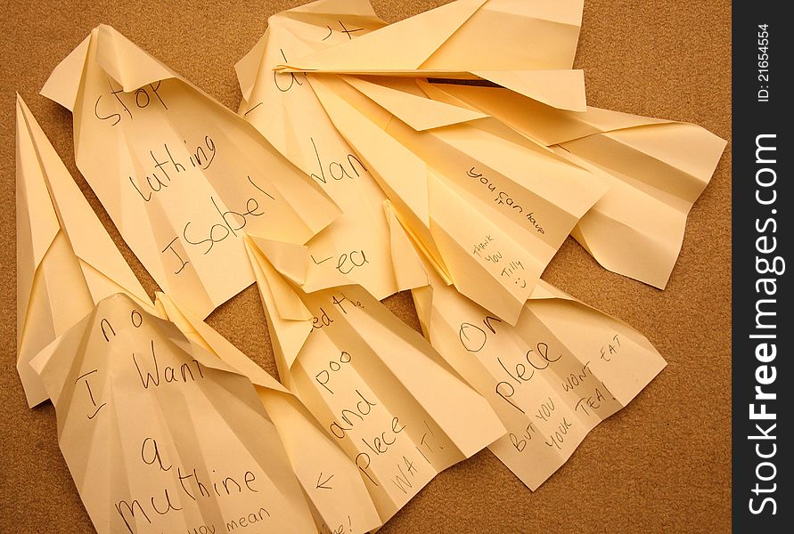 Child's Messages written on paper aeroplanes