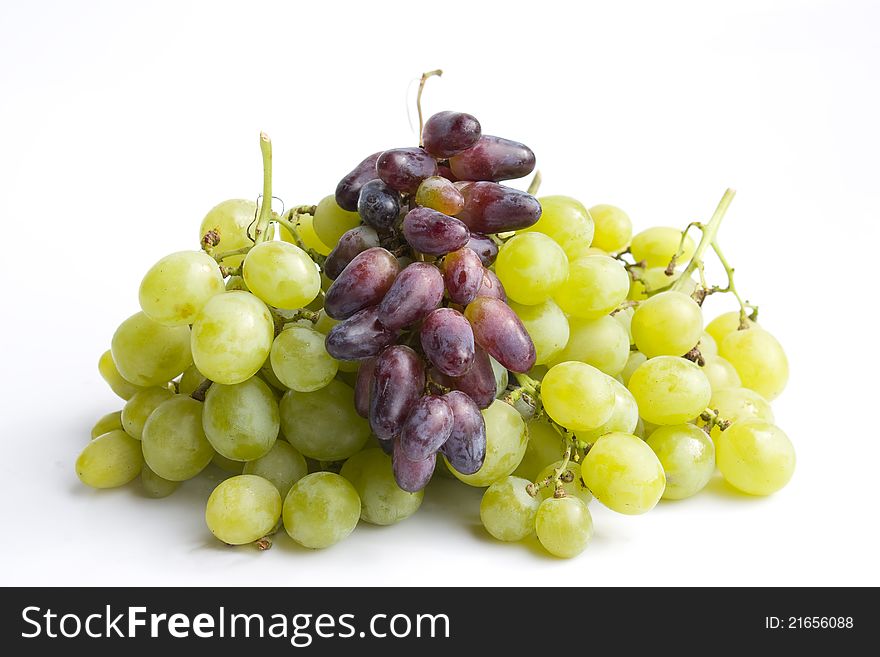 Green and red grapes  in a white background.