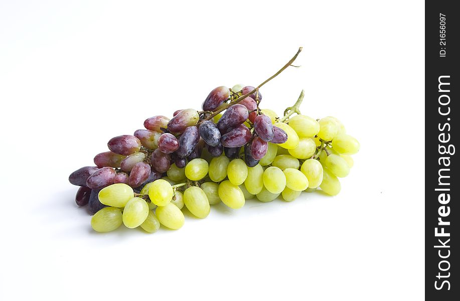 Green and red grapes  in a white background.