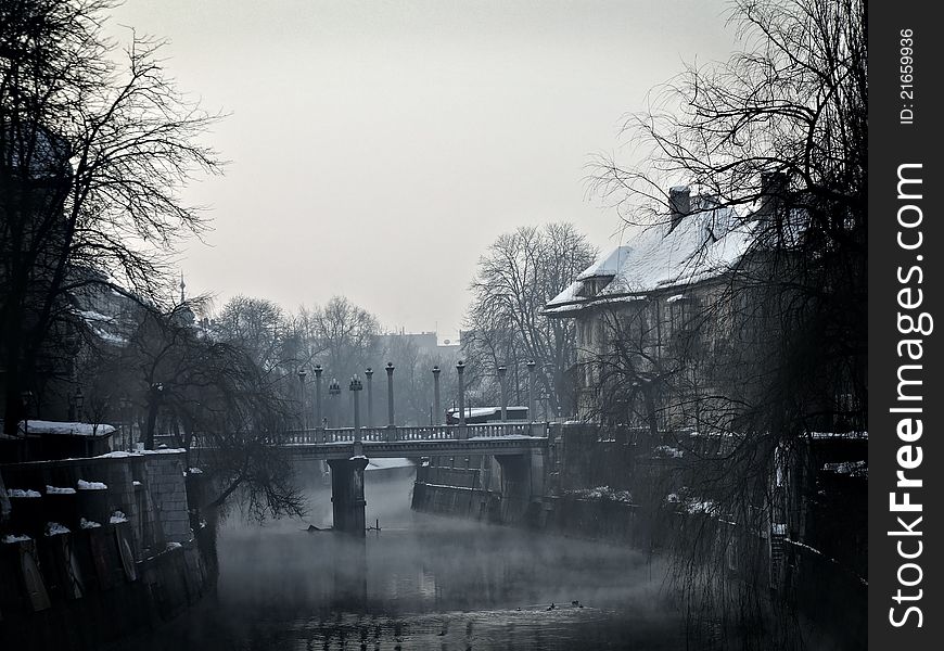 City center of the City of Ljubljana, the capitol of Slovenia. It is the picture of winter morning on the banks of the small river in the City of Ljubljana