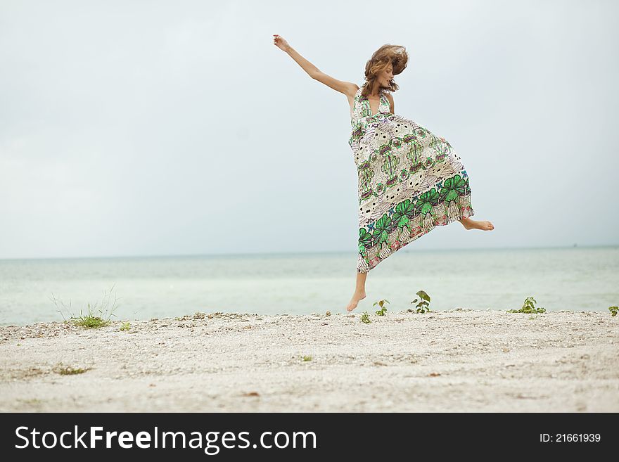 Girl Jumping On Beach