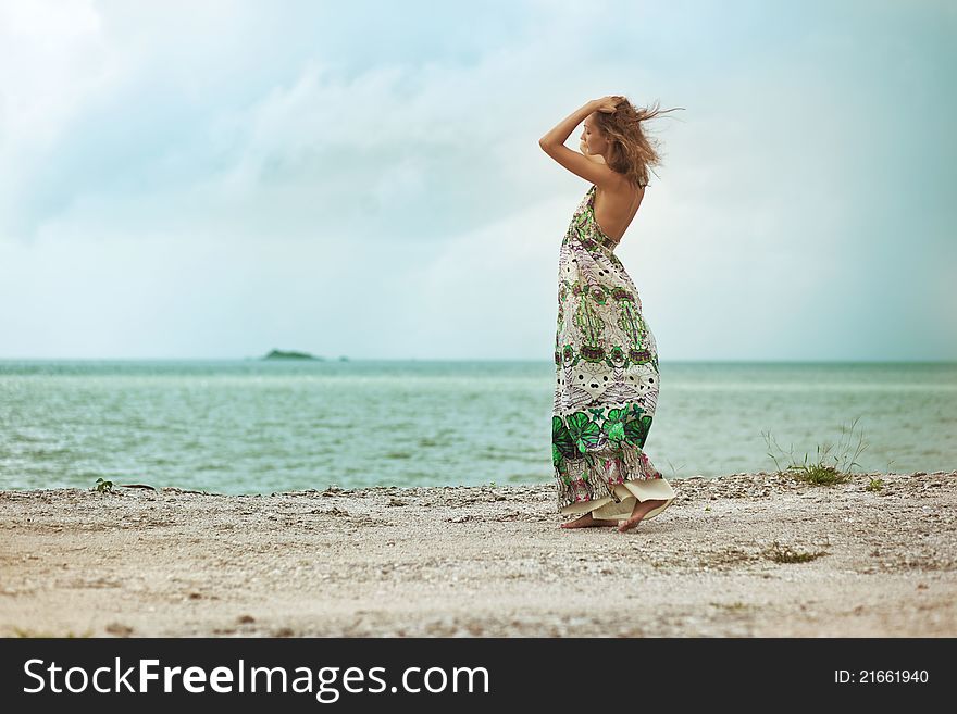 Woman walking on beach, feels free