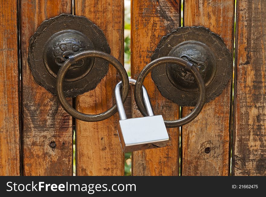 Wooden door with the old gold lock. Wooden door with the old gold lock