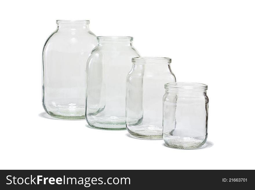 Four different sizes of empty glass jars, on white background. Four different sizes of empty glass jars, on white background