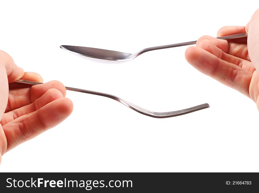 Fork and spoon in hands on white background