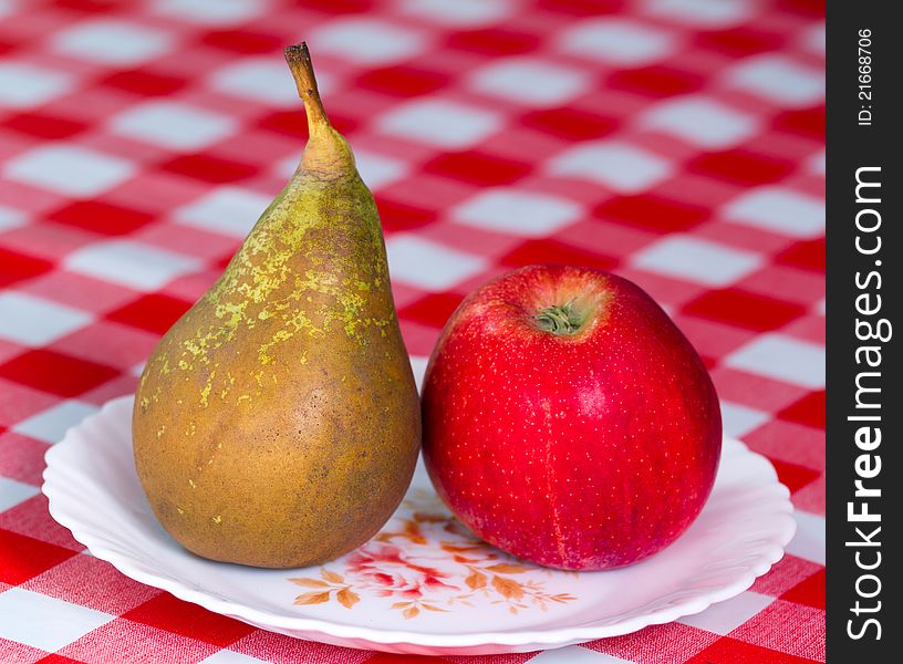 Delicious apple and pear on the table