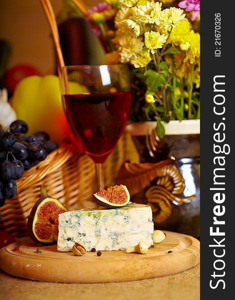 Composition of cheese, grapes and autumn fruits. Composition of cheese, grapes and autumn fruits