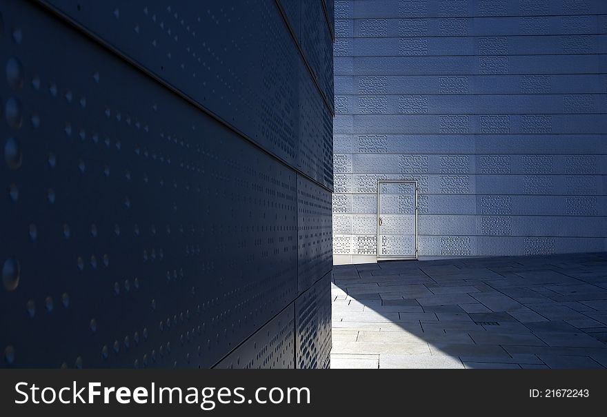 Modern architecture with door and shade in urban exterior scene. Modern architecture with door and shade in urban exterior scene