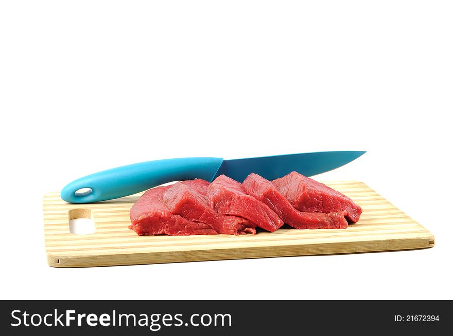 Fresh raw meat and knife, on a white background