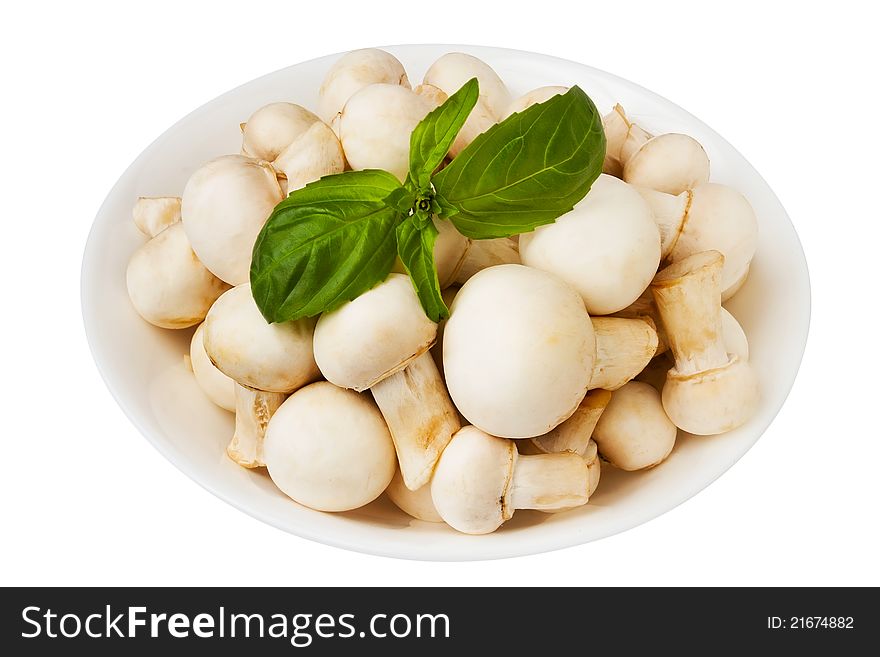 Champignons in a bowl against white. Champignons in a bowl against white