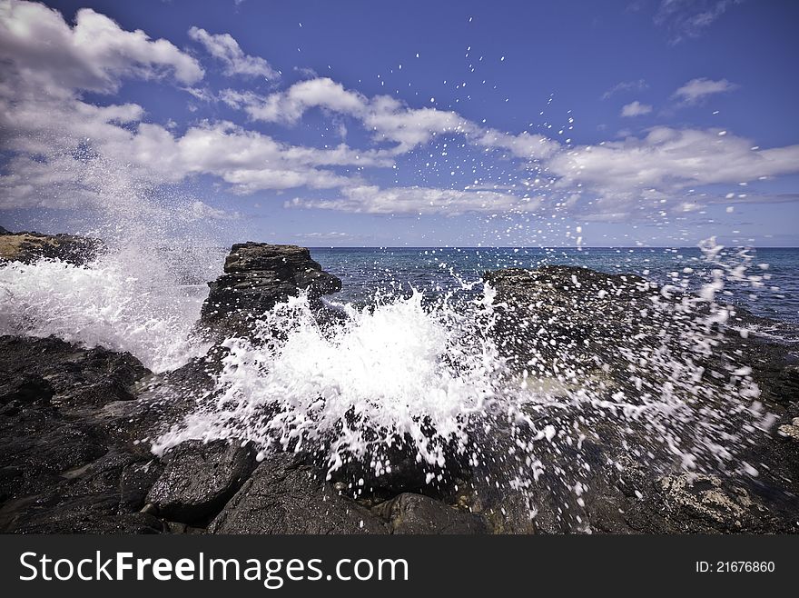 A powerful wave hits some rocks and comes straight at you. A powerful wave hits some rocks and comes straight at you.