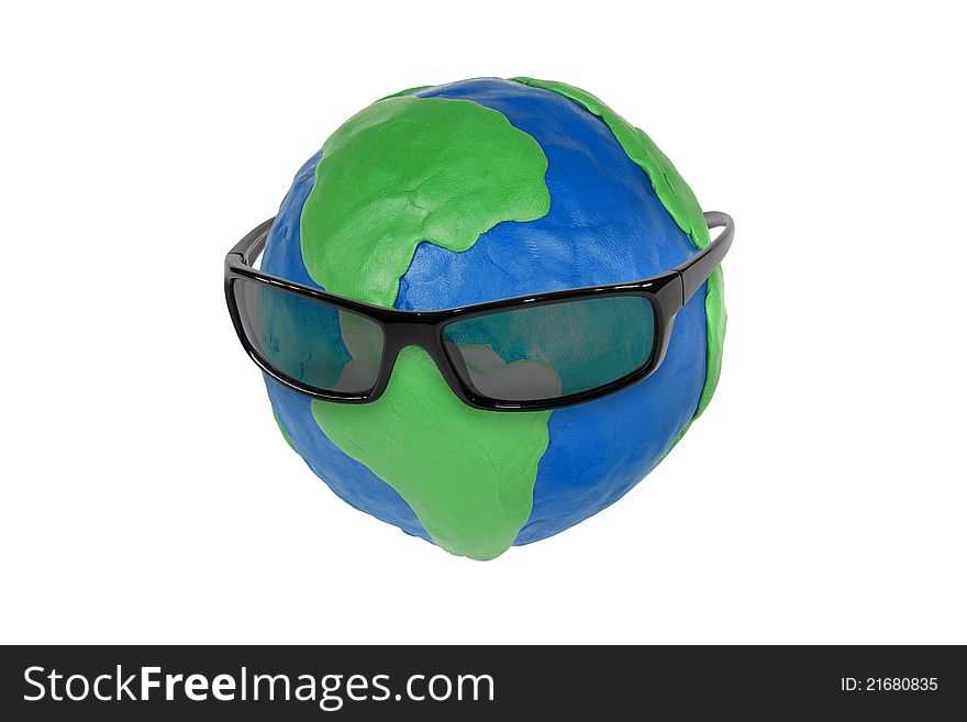Sunglasses and plasticine globe on white background. Sunglasses and plasticine globe on white background