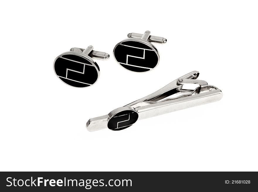 Silver cuff link and tie pin isolated on white background