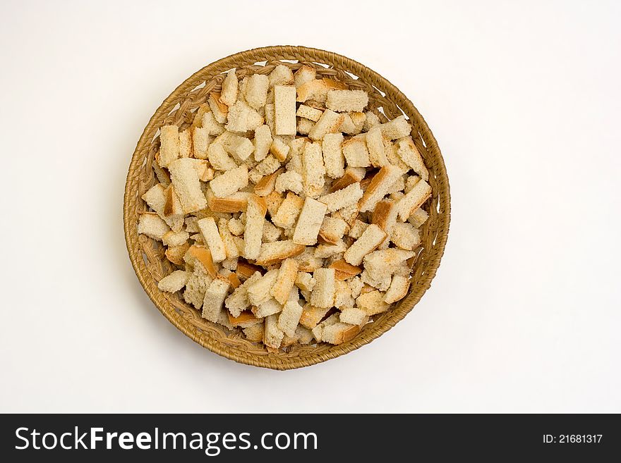 A dish of crackers on a white background