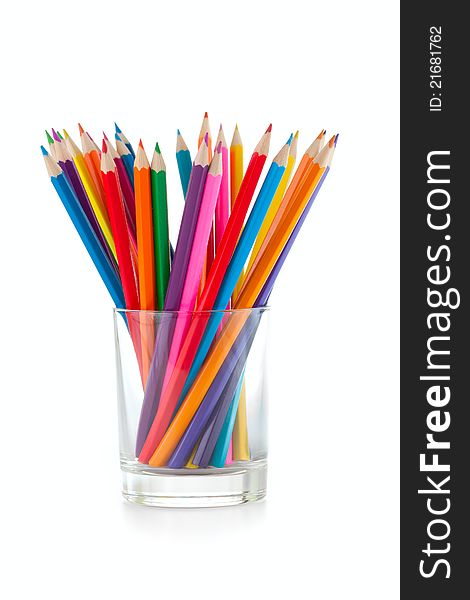 Color pencils pile in glass on white