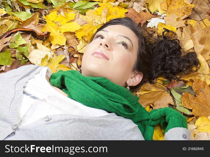 Young Woman Resting On Leaves