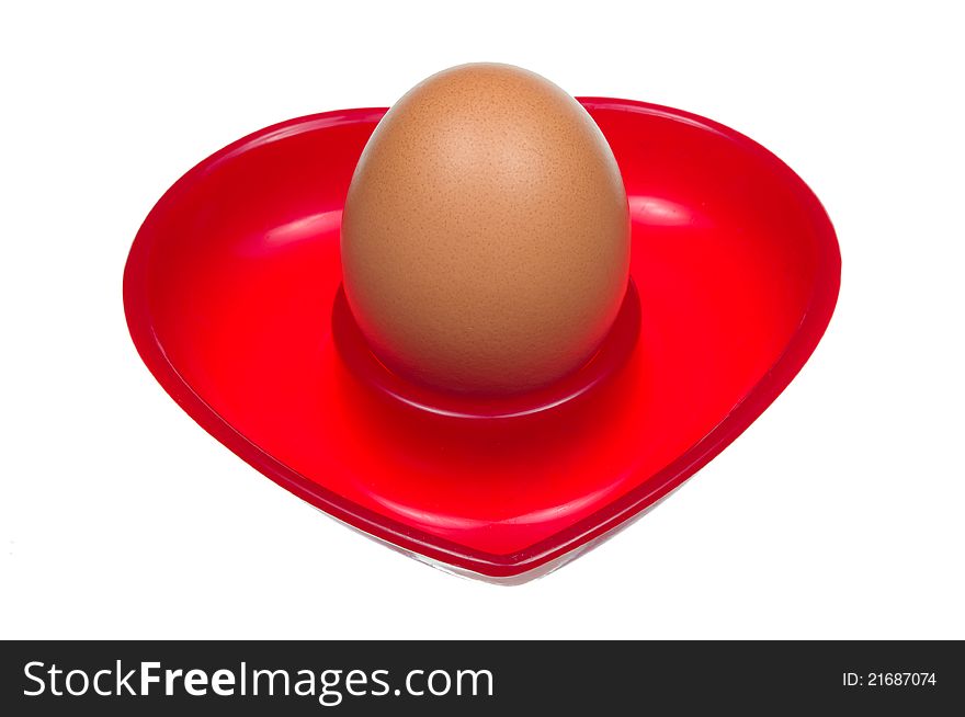 Egg on a stand in the shape of a heart