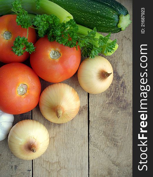 Fresh vegetables on a wooden background closeup