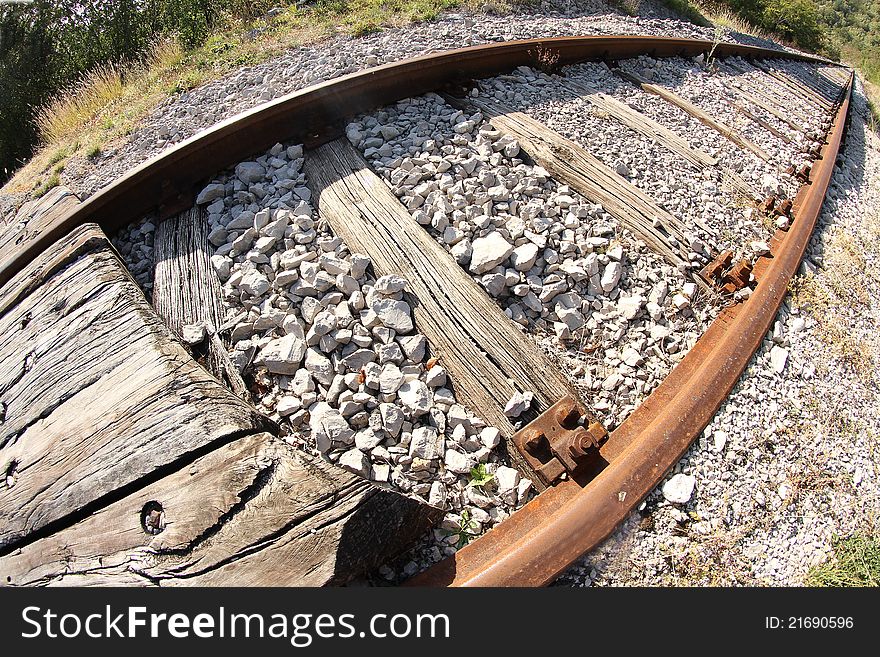 View of railway tracks receding through countryside