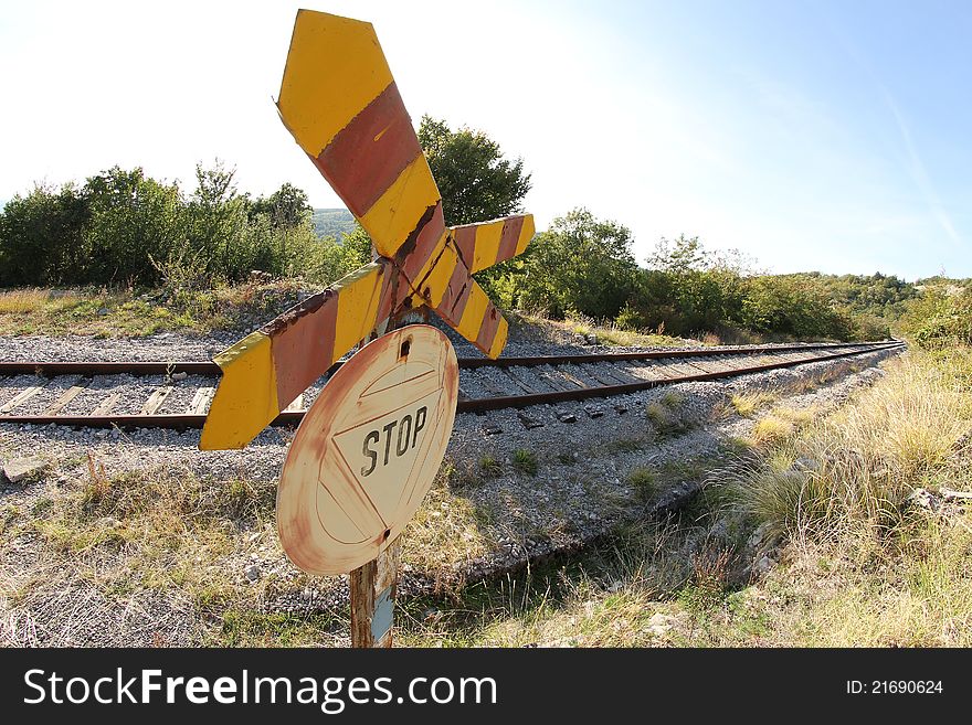 View of railway tracks receding through countryside