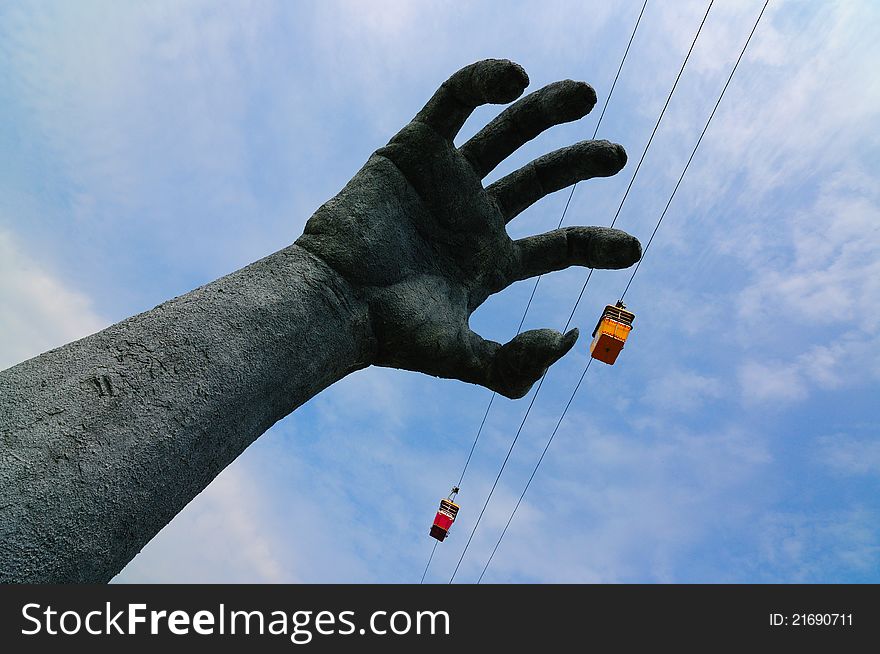 Giant arm catching cable car