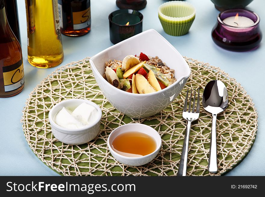 Healthy breakfast with flakes, yogurt and honey