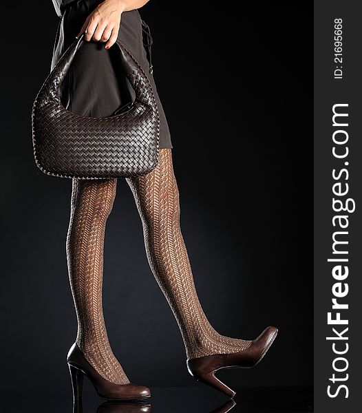 Woman sexy legs with handbag. Woman sexy legs with handbag