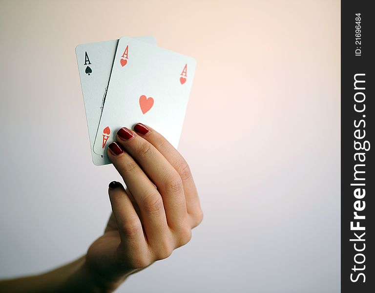 Woman with card poker aces