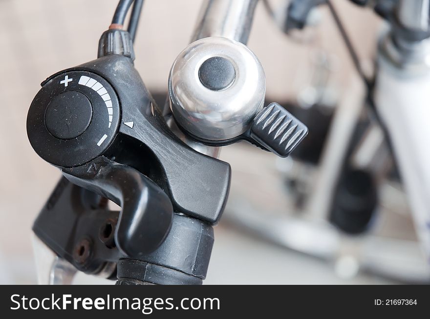 Detail of bell, brake and hand grip of a bicycle. Detail of bell, brake and hand grip of a bicycle.