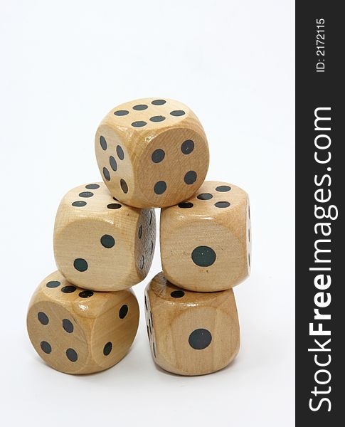 Five wooden gambling dices isolated on white background