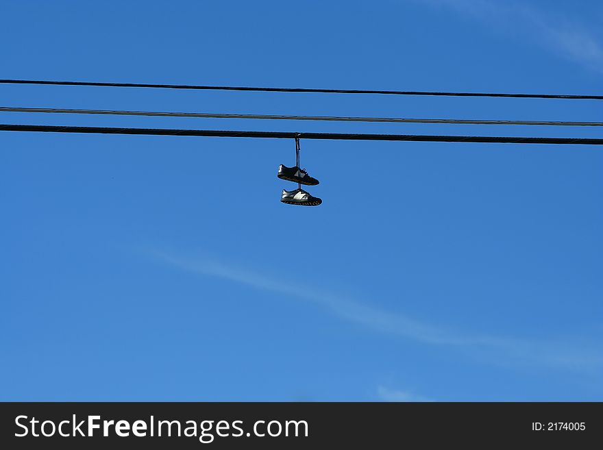 An image of a pair of hanging sneakers