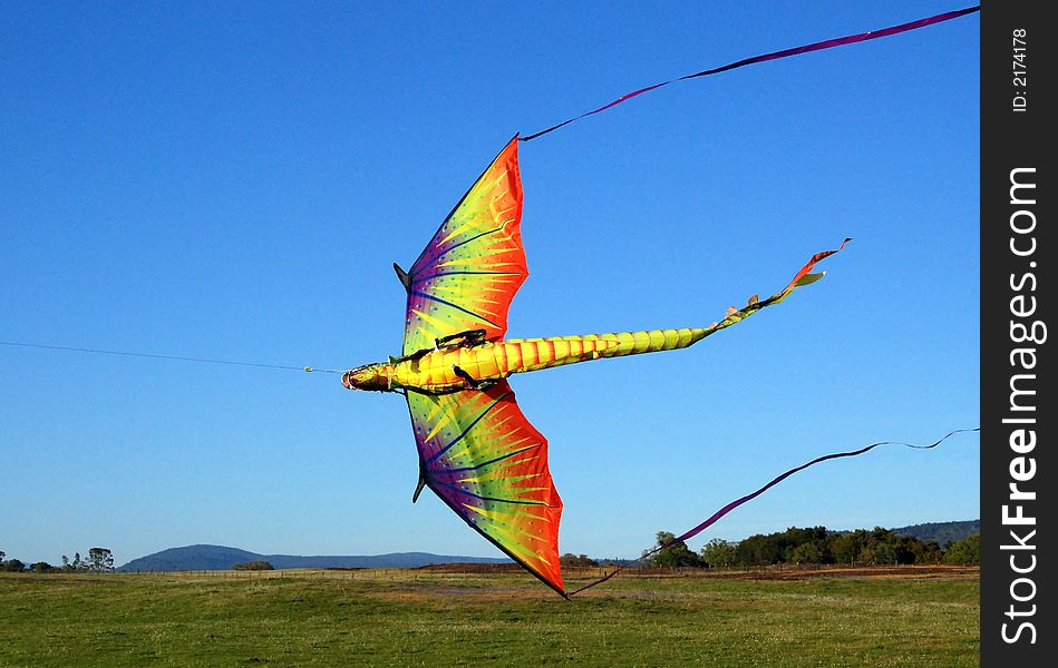 Colorful dragon kite against blue sky. Colorful dragon kite against blue sky