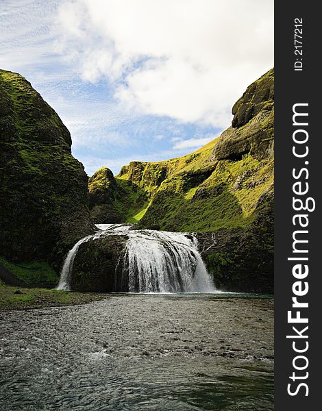 Stjornarfoss waterfall in Iceland on a sunny day