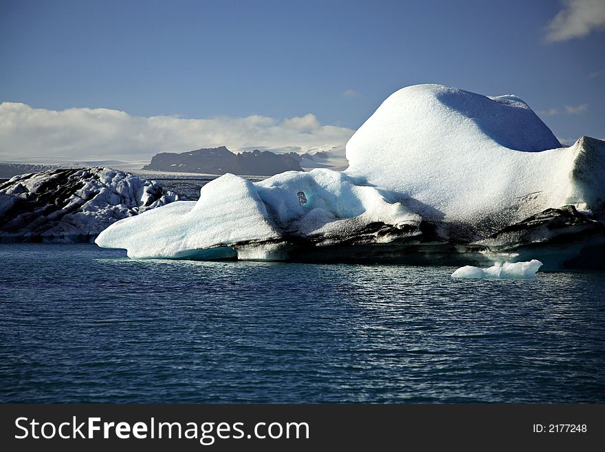 Blue and white icebergs floating on Jokulsarlon lagoon Iceland