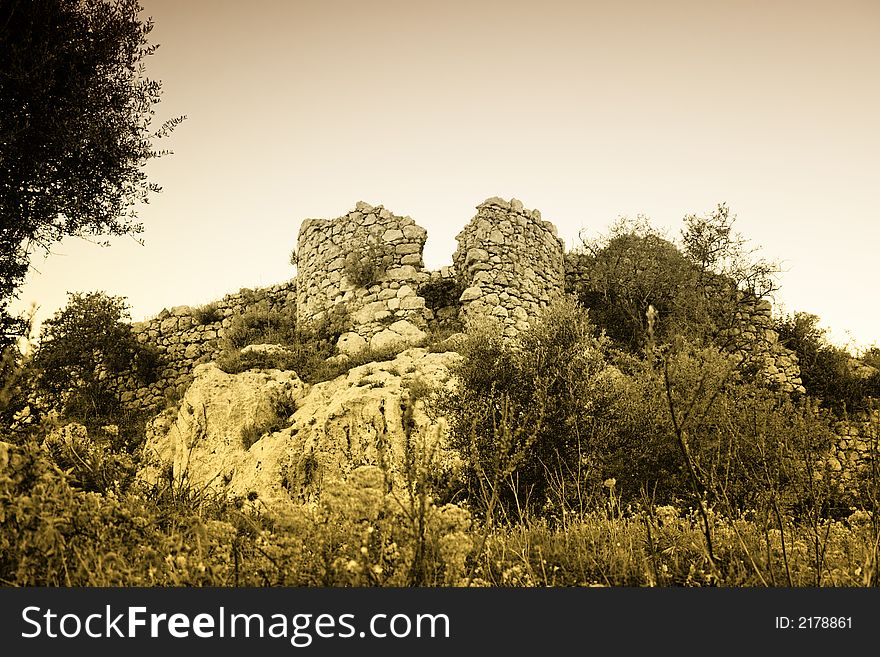 Ruin of the ancient fortress byzantine, visible the tower. Sicilian Landscape.