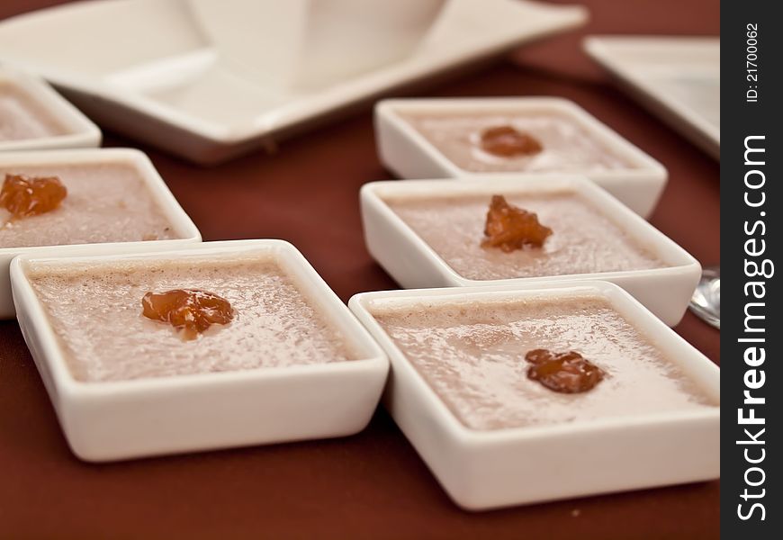 Sweet jelly with jam in little plates.