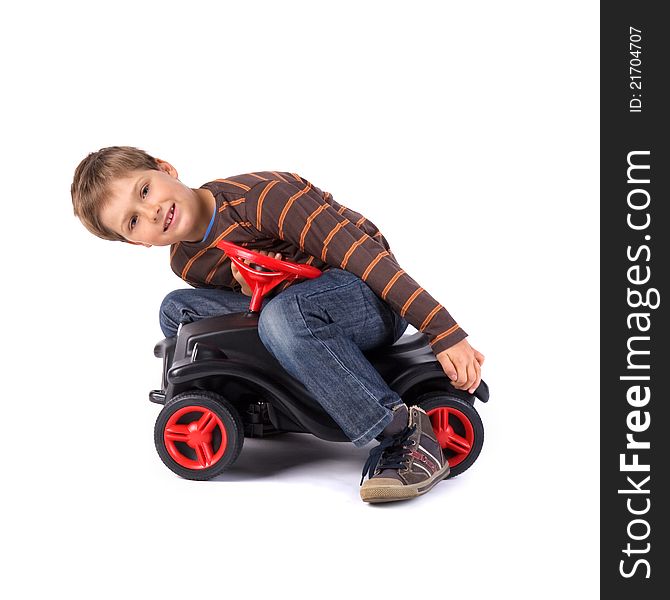 Young little boy playing with his car. Young little boy playing with his car