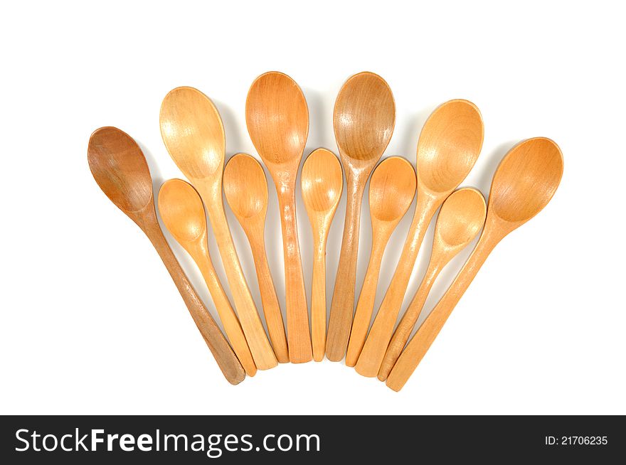 Assortment of handmade wooden spoons,  on a white background