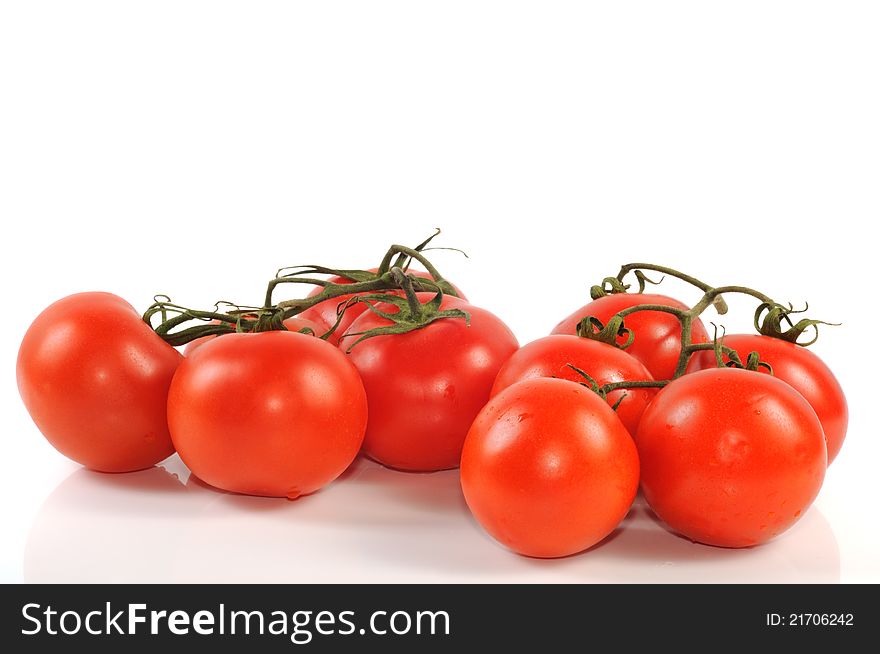 Fresh red tomatos  on a white background