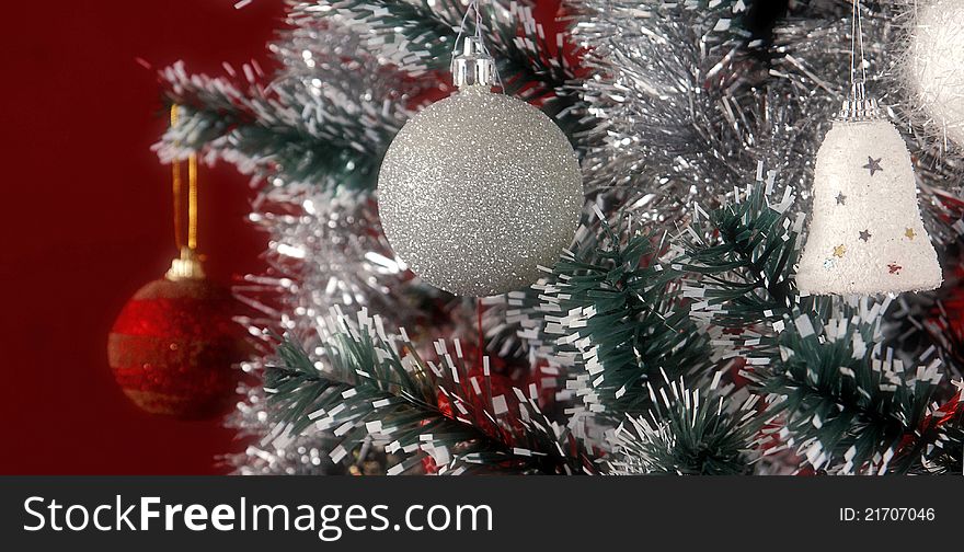 Christmas tree with ornaments, ribbons and candles