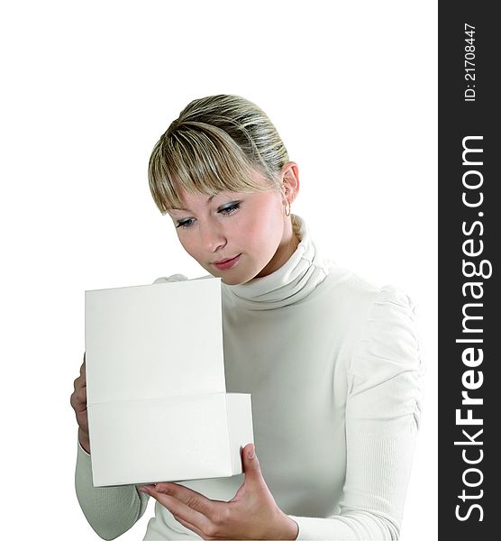 Pretty young girl looks in a white cardboard box