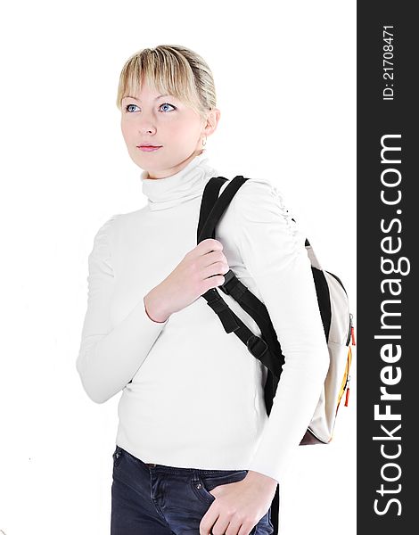 Pretty young girl in white sweater and a backpack