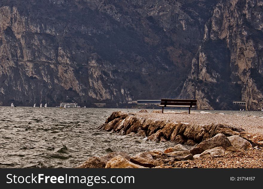 Old bench at the water, Lago di Gardo, Italy